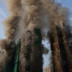 Flames engulf bamboo scaffolding across multiple buildings at Wang Fuk