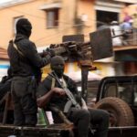 Soldiers patrol on the main road in Bissau
