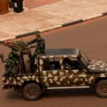 Soldiers patrol near the presidential palace in Bissau