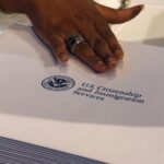 Information packs are distributed by the U.S. Citizenship and Immigration