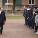 France’s President Macron reviews the troops prior to his speech