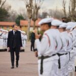 France’s President Macron reviews the troops prior to his speech