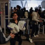 People transport supplies to the scene of the Wang Fuk