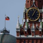 The Russian flag flies on the dome of the Kremlin
