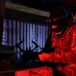 Ukrainian serviceman of an air defence unit checks an FPV-drone