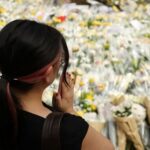 Flower tributes for victims of the deadly fire near the