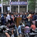 Public prosecutor Khan Moinul Hasan addresses the media after the