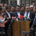 Public prosecutor Khan Moinul Hasan addresses the media after the