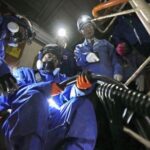 FILE PHOTO: TEPCO employees conduct a drill to secure external