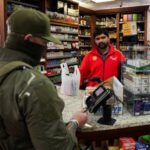 A Border Patrol agent buys goods at a gas station