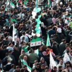 Residents of Hama demonstrate to mark the first anniversary of