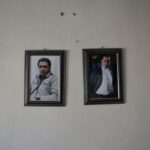 Photographs of Alia Darraj’s son and son-in-law hang displayed on