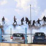 Greek farmers hurl stones amid tear gas at the Heraklion