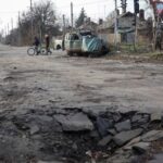 Residents cross a street in the frontline town of Kostiantynivka