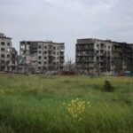 A view shows apartment buildings damaged by Russian military strikes