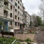 A view shows apartment buildings damaged by Russian military strikes