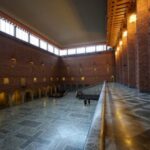 People walk inside the Blue Hall at City Hall (Stadshuset),