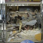 A worker cleans up inside a commercial facility in Hachinohe