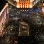 A drone view shows protesters demonstrating outside the parliament during