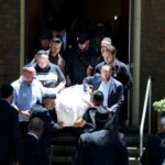 Mourners carry the casket of 10-year-old Matilda the youngest victim