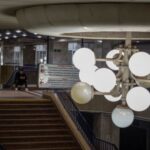 People take shelter inside a metro station during a Russian