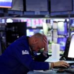 Trader works during the closing bell, on the floor at