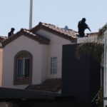 Security forces operate near a crime scene where a U.S.