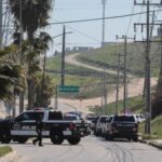 Security forces operate near a crime scene where a U.S.