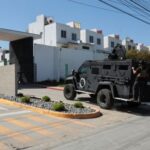 Security forces operate near a crime scene where a U.S.