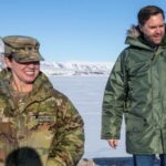 U.S. Vice President JD Vance walks with Col. Susannah Meyers,