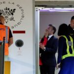 Macron’s face appears to be shoved by wife in Vietnam