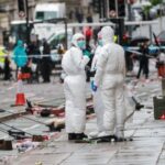 Aftermath of an incident where a car hit fans at