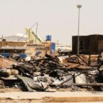 A view of a burned building and the tail of