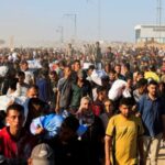 Palestinians receive aid from the U.S.-backed Gaza Humanitarian Foundation, in