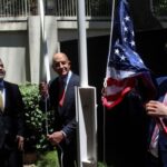 Syrian Foreign Minister Asaad Hassan al-Shibani stands next to U.S.
