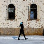 FILE PHOTO: A woman walks outside St. Iveron Convent in