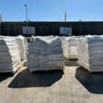 Supplies wait to be loaded on trucks to go into