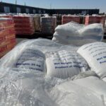 Supplies wait to be loaded on trucks to go into