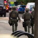 Police work at the scene after an attack that injured