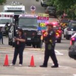 Police work at the scene after an attack that injured