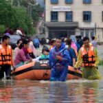 Members of NDRF team evacuate patients, attendants and medical staff