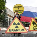 Activists of Greenpeace attend a protest near the Russian Embassy