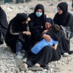 FILE PHOTO: Palestinians mourn loved ones killed in Israeli fire,