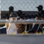 Federal agents unload detainees at the Broadview ICE detention center