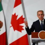 Mexican President Claudia Sheinbaum and Canadian PM Mark Carney hold