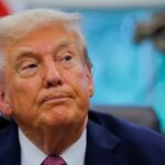 U.S. President Donald Trump signs an executive order at the