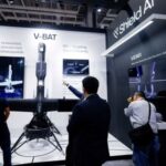 FILE PHOTO: Visitors look at Shield AI’s V-BAT unmanned aerial