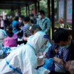 FILE PHOTO: Medical worker in a protective suit conducts a
