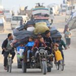 Displaced Palestinians, fleeing northern Gaza due to an Israeli military