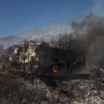 FILE PHOTO: Wildfire burns in Thymari, near Athens